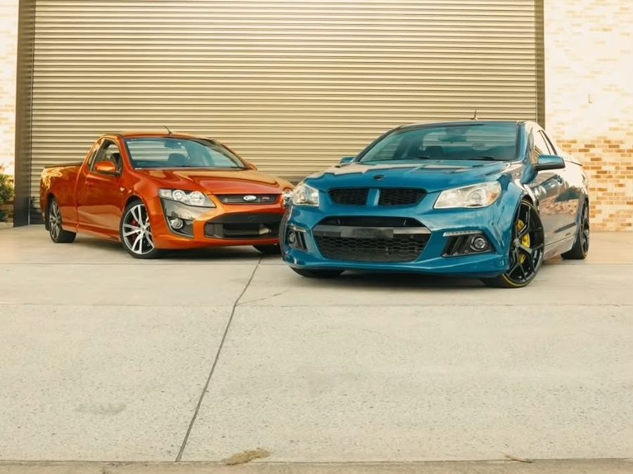 Orange FPV Pursuit ute and blue HSV Maloo outside a roller door